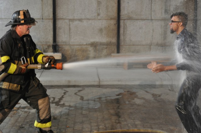 Dread Scott performing “On the Impossibility of Freedom in a County Founded on Slavery and Genocide” under the Manhattan Bridge (photo by Hrag Vartanian for Hyperallergic) 