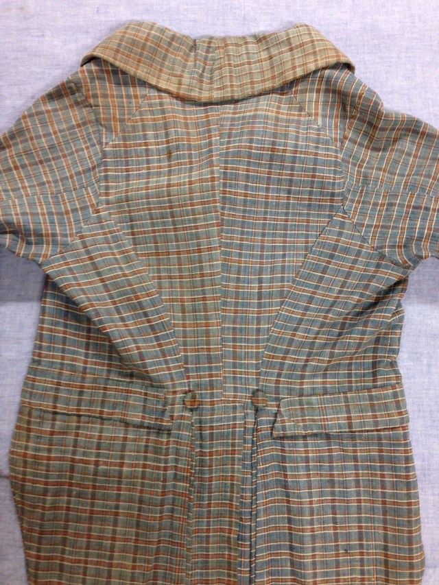 1967.13.17, back view of "Stonington Plaid" checked linen coat. Gift of Mrs Muriel Buckley, URI Textiles Collection.