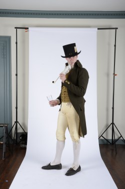 man in historical clothing smoking a pipe