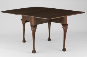 dark wooden drop leaf table with trifid feet