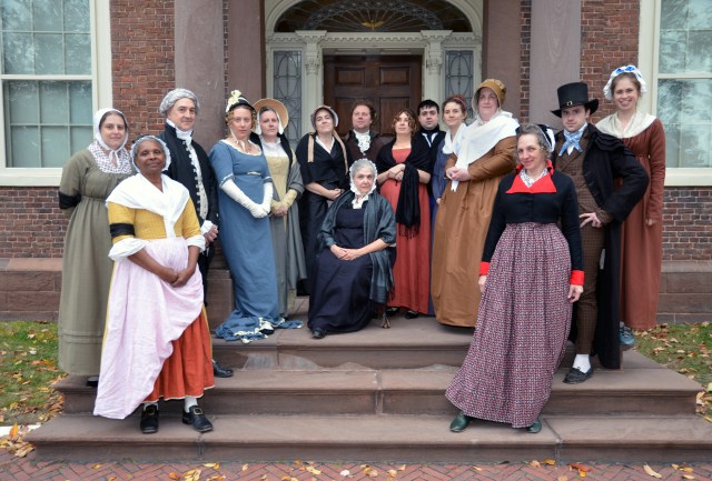 costumed interpreters on the steps of the John Brown House